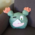 Coussin en forme de cactus avec visage souriant et oreilles colorées, exemplaire du patron de couture PDF à télécharger, Coussins cactus à personnaliser.