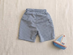 Patron PDF Short enfant TWIST du 2 au 16 ans, short à carreaux bleu et blanc en coton, vue à plat