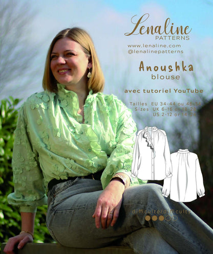 Blouse Anoushka patron de couture pdf à télécharger avec col montant et manches longues froncées, porté par une femme assise.