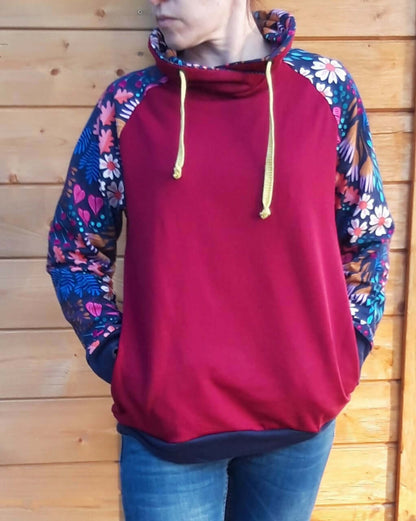 Le SWEAT FLEX adulte mixte du S au XL avec capuche et manches raglan colorées.