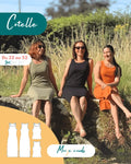 Trois femmes portant le Patron PDF Robe Cotelle du 32 au 52, assises sur pierre dans un champ