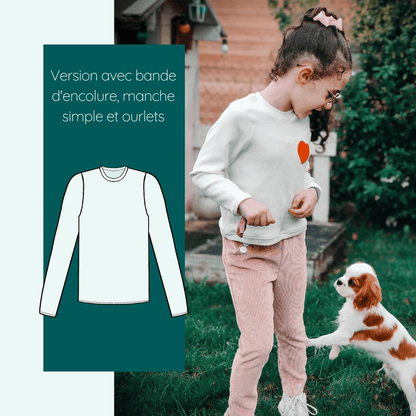 Fille portant un sweat Calao avec manche simple, jouant avec un chien, style sportswear.